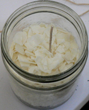 A layer of soy wax flakes is added
